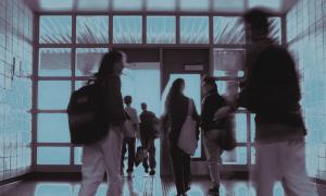 Out of focus photo of students walking on school halls