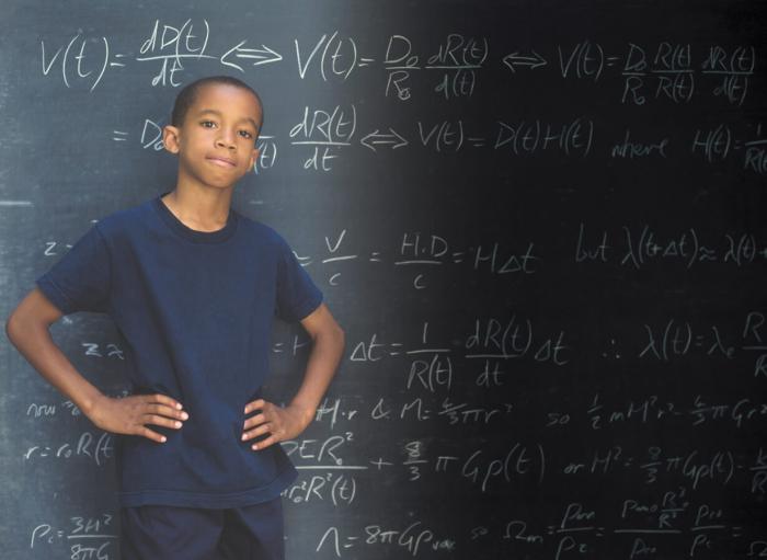 Student in front of chalkboard