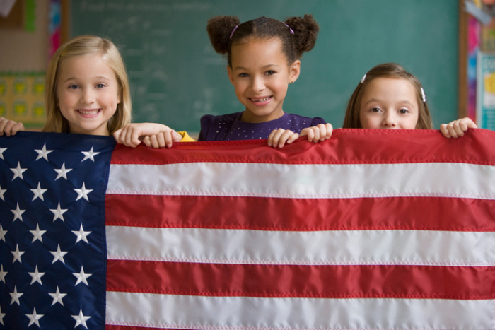 Teaching Tolerance kids with flag