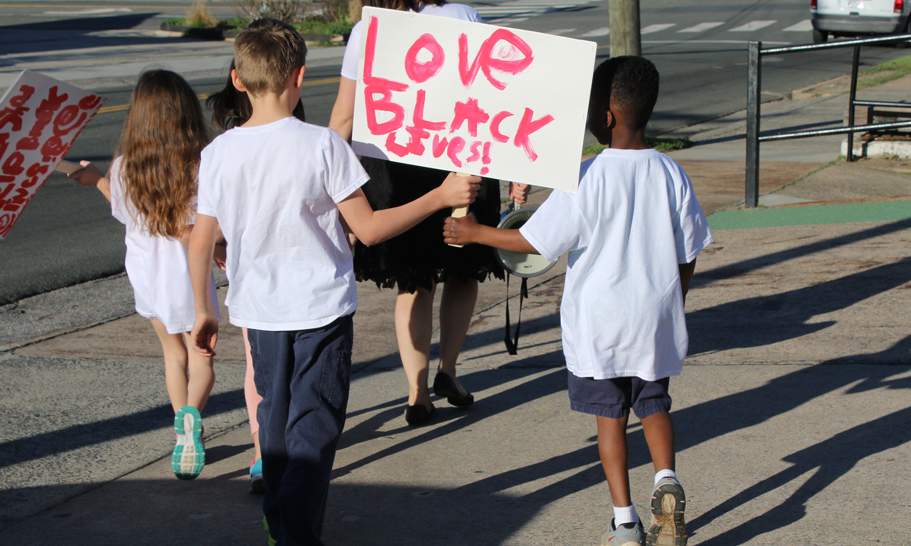 Students marching with Black Lives Matters sign