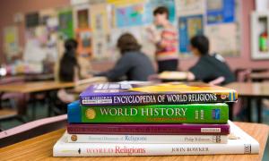 Stock of books about religion inside a classroomi