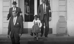 Ruby Bridges walks down the stairs of the schoolhouse