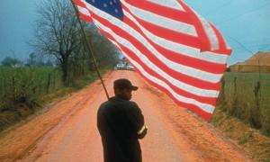 Man carrying the American flag