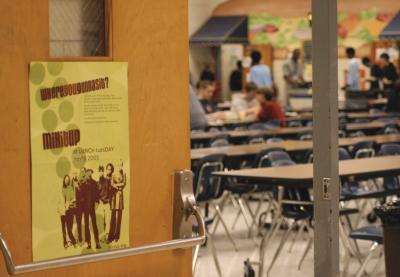Mix It Up poster at a school cafeteria door, while students eat in the background