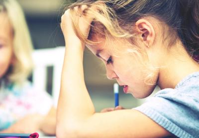 girl concentrating on school work