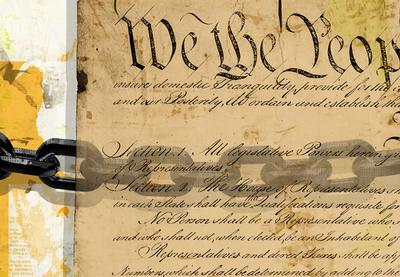Chains superimposed over an image of the United States Constitution.