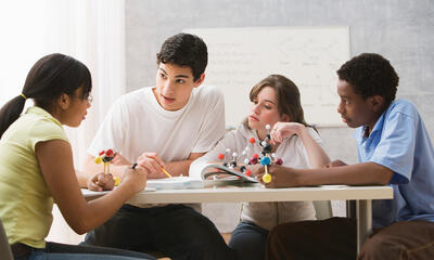Students talking at a table
