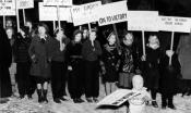 Children carry pickets in support of the strikers on Women’s Day during the Flint Sit–Down Strike.