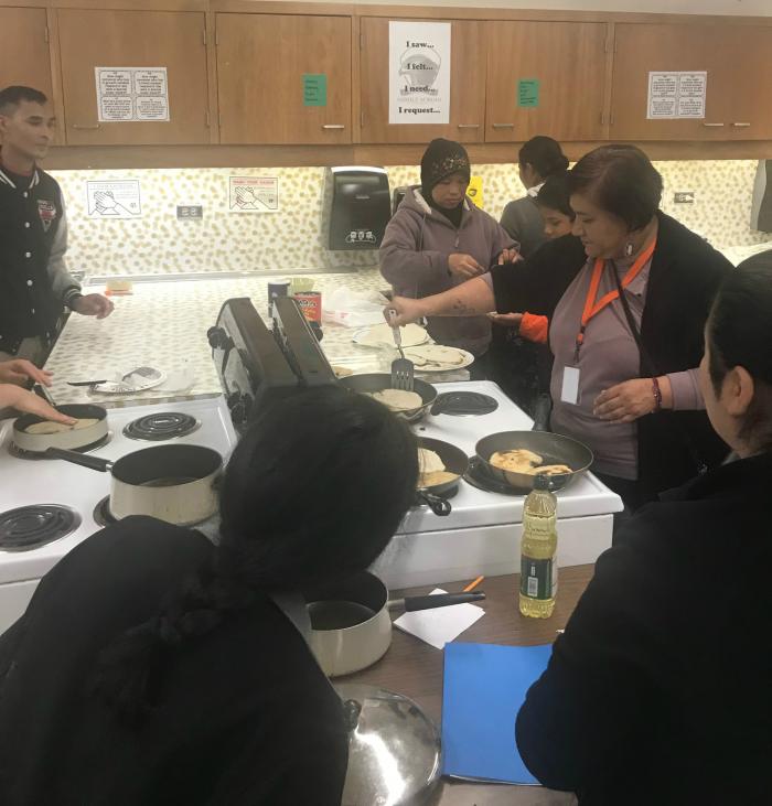 Parents cooking in the Culturally Inclusive Cooking Club