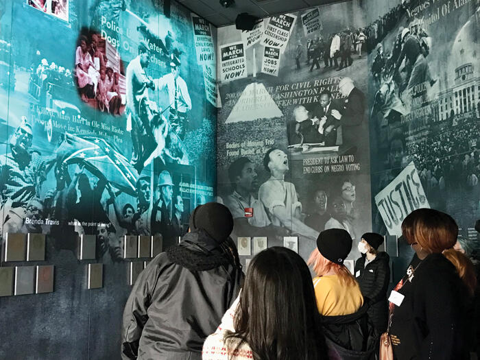 Several students in the Civil Rights Memorial Center.